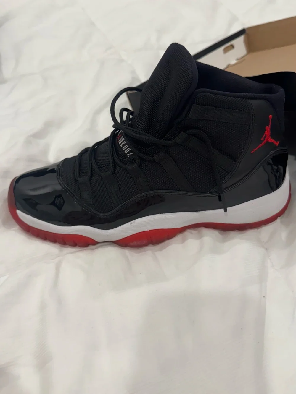 Air Jordan 11 Retro (GS) Black and Red High-Top Sneakers